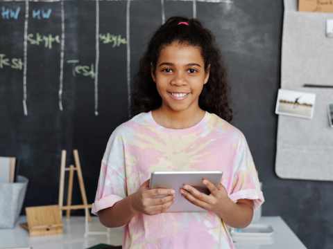 Girl with tablet at school